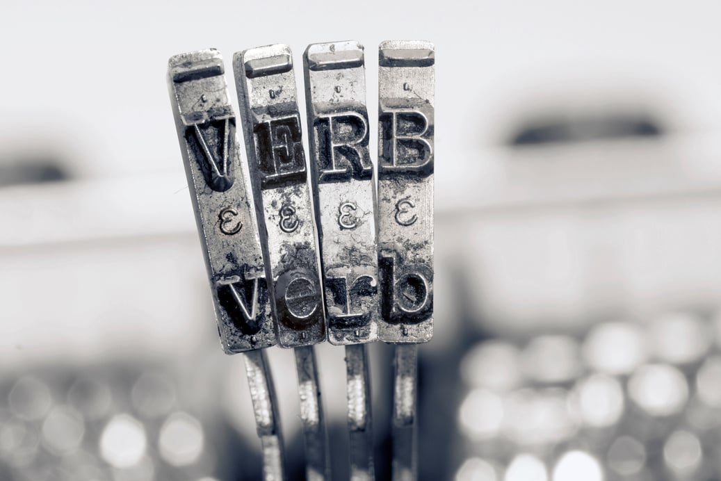 the word VERB with old typwriter keys